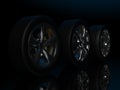 auto wheels on a dark background. Royalty Free Stock Photo