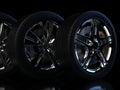 Auto wheels on a dark background with chrome rims close-up