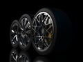 auto wheels on a dark background. Royalty Free Stock Photo
