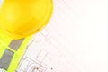 Autocad drawing, Architecture and construction, builder`s hard hat and safety vest on architectural blueprints