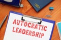 AUTOCRATIC LEADERSHIP phrase on the piece of paper Royalty Free Stock Photo