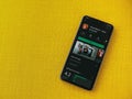 Autodesk SketchBook - draw and paint app play store page on smartphone on a yellow fabric background