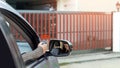 Hand using remote control to open the automatic gate . The auto garage and home security system Royalty Free Stock Photo