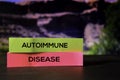 Autoimmune Disease on the sticky notes with bokeh background