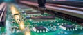 Automated assembly of circuit board, mount of microchip in pcb at semiconductor factory. Detail of machine line in computer plant