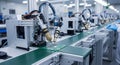 Automated Assembly Line with Robotic Arms Soldering Electronic Components on Conveyor Belt in Modern Manufacturing Facility Royalty Free Stock Photo
