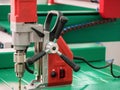 Automated CNC equipment for working with metal at factory. Electro drill machine. The programmed robot head. Royalty Free Stock Photo