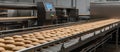 Automated conveyor belt moves bread in a bakery.