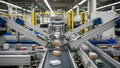 Automated Conveyor Belt System in a Modern Warehouse with Cardboard Boxes Moving Through Royalty Free Stock Photo