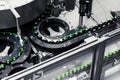 Automated conveyor line in a brewery. Rows of green glass bottles on a conveyor belt. Royalty Free Stock Photo