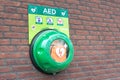 Automated external defibrillator on a wall