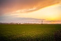 Automated farming irrigation system in sunset Royalty Free Stock Photo