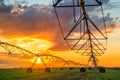 Automated farming irrigation system in sunset Royalty Free Stock Photo