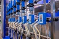 Automated goat milking suction machine with teat cups at exhibition