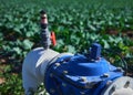 Automated irrigation valve in a broccoli plantation Royalty Free Stock Photo