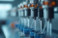Automated lab equipment dispenses precise liquid volumes into sample cups. Multiple titrator units work in unison for analytical Royalty Free Stock Photo