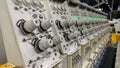 Automated machinery in a textile factory with green lights indicating Royalty Free Stock Photo