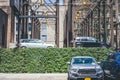 An automated multi-level outside parking system in Manhattan, New York City. Hedge surrounding the parking lot