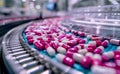 Automated pharmaceutical production line producing small white pills in bottle. The manufacturing process of medical pills on a Royalty Free Stock Photo