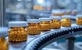 Automated pharmaceutical production line producing small white pills in bottle. The manufacturing process of medical pills on a Royalty Free Stock Photo