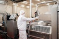 Automated production line with packaging and cutting of meat in modern food factory.Meat processing equipment.