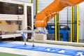 Automated robotic arm picking plastic forming sheet in industry Royalty Free Stock Photo