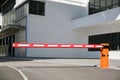 Automatic barrier at the entrance to the parking lot near the public building Royalty Free Stock Photo