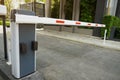 Automatic Barrier Gate , Security system for building and car entrance vehicle barrier of a beautiful and shady village Royalty Free Stock Photo