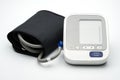 Automatic blood pressure monitor with wide range cuff on white background
