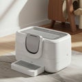 Automatic cat litter box with a sleek, modern design in white and gray. It features a Royalty Free Stock Photo