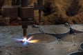 Automatic cnc plasma cutting with computer. An electrical arc is then formed within the gas, between an electrode near or integrat Royalty Free Stock Photo