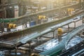 Automatic conveyor line or belt with glass bottles at brewery production. Industrial beer bottling equipment machinery Royalty Free Stock Photo