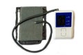Automatic digital blood pressure monitoring meter on white background. Royalty Free Stock Photo
