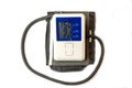 Automatic digital blood pressure monitoring meter on white background. Royalty Free Stock Photo