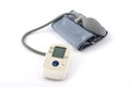 Automatic digital blood pressure monitoring meter on white background Royalty Free Stock Photo