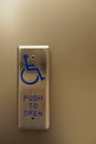 Automatic door opener for wheelchair accessibility