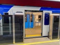 Automatic door platform system at a new modern metro station. Metro security system glass beautiful doors open synchronously with Royalty Free Stock Photo