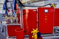 Automatic dosing, mixing and pouring unit for hot curing three-component polyurethane elastomers Royalty Free Stock Photo
