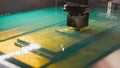 Automatic factory - cutting of sheet metal process in water, front view Royalty Free Stock Photo