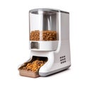 Automatic feeder. Automatic pet food dispenser on floor of house. Smart pet feeder.