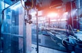 Automatic filling machine pours water into plastic PET bottles. Royalty Free Stock Photo