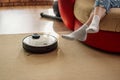 Automatic floor scrubber and legs on carpet, smart appliances in the home