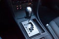 Automatic gear knob in the passenger compartment in black for driving and acceleration. Abstract image of fast speed Royalty Free Stock Photo