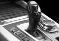 Automatic gear stick of a modern car, car interior details, close up. Car detailing. Black and white. Automatic transmission lever Royalty Free Stock Photo