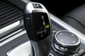 Automatic gear stick of a modern car. Car interior details. Transmission shift Royalty Free Stock Photo