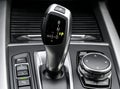 Automatic gear stick of a modern car. Car interior details. Transmission shift Royalty Free Stock Photo