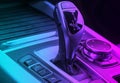 Automatic gear stick of a modern car. Modern car interior details in blue and pink tones. Close up view. Car inside. Automatic Royalty Free Stock Photo