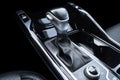 Automatic gear stick of a modern car. Modern car interior details. Close up view. Car inside. Automatic transmission lever shift. Royalty Free Stock Photo