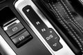 Automatic gear stick of a modern car. Modern car interior details. Close up view. Car detailing. Automatic transmission lever shif Royalty Free Stock Photo