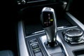 Automatic gear stick transmission of a modern car, multimedia and navigation control buttons. Car interior details. Transmission Royalty Free Stock Photo
